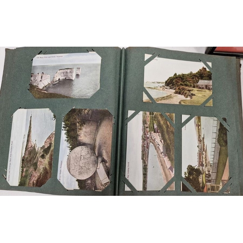 142 - Two vintage postcard albums containing postcards from the 19th and 20th centuries, a Victorian photo... 