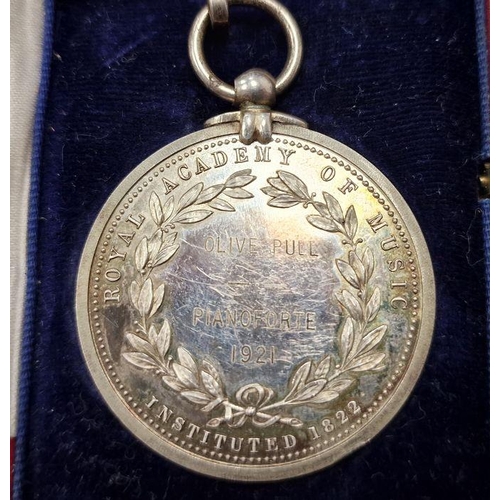 167 - Silver-coloured metal medal for the Royal Academy of Music, inscribed 'Olive Pull Piano Forte 1921' ... 