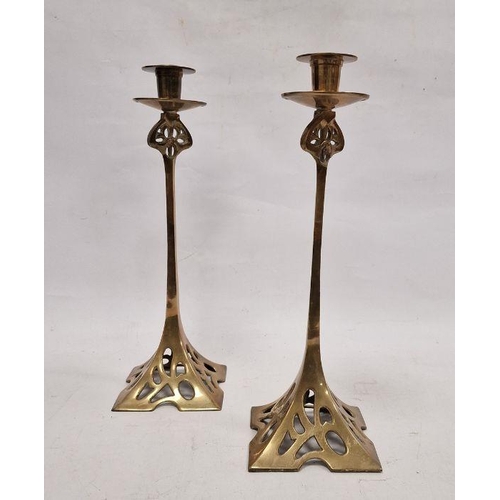 188 - Pair of Art Nouveau brass candlesticks with shaped square pierced bases