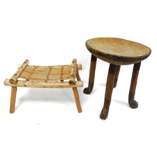 215 - Three African stools,one beaded animal decoration to the seat, one with reeded seat and one further.