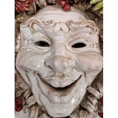 24 - Perseo pottery Bachanalian wall mask with smiling face and fruiting vine, 42cm high x 44cm wide appr... 