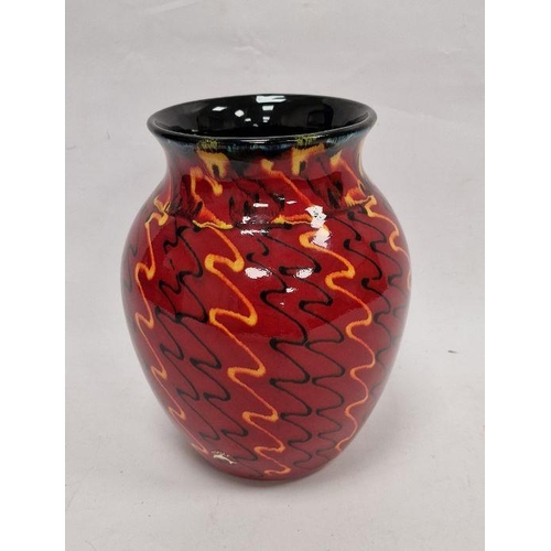 27 - Modern Poole pottery vase with everted rim, ovoid body, the red ground decorated with black and oran... 