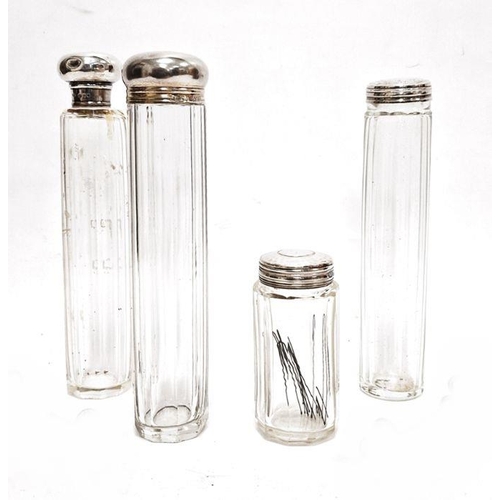 335 - Four various cut glass and silver-topped toilet jars (4)