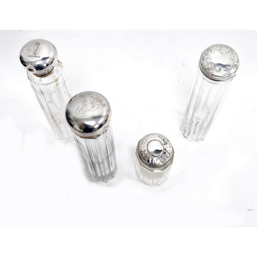 335 - Four various cut glass and silver-topped toilet jars (4)