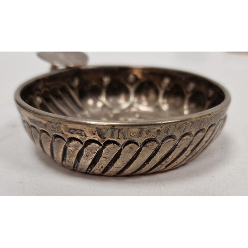 348 - Antique French silver-coloured metal tastevin of typical form with gadrooned sides, circa 1830 and i... 