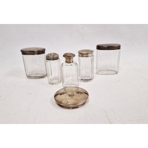 378 - Assorted glass bottles with silver and white metal lids