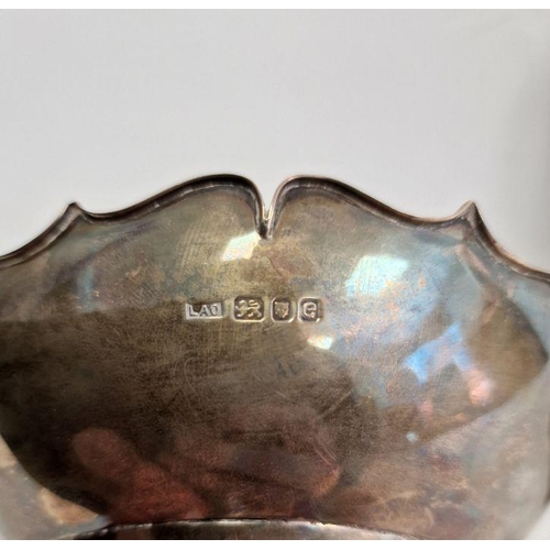 386 - Silver bowl raised on three feet, London assay office mark and four boxed silver salts raised on thr... 