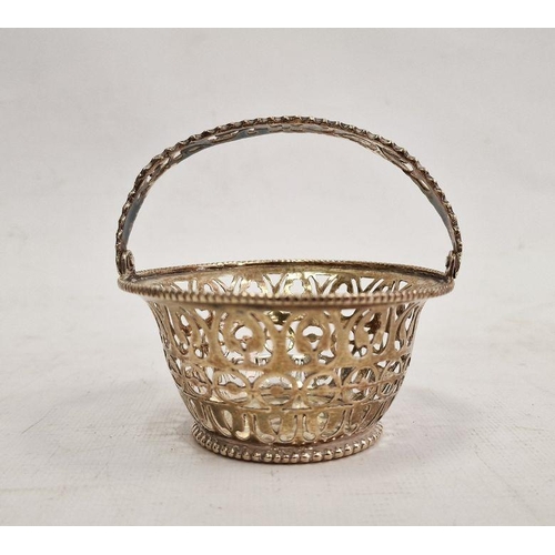 413 - Foreign silver-coloured pierced flared cylindrical basket, the pierced swing handle within beaded ri... 