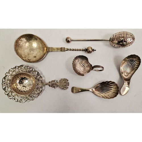 419 - Three Georgian silver tea caddy spoons each with shell bowls, a Victorian egg-shaped tea infuser pie... 