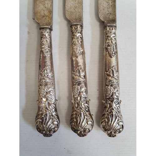 421 - Set of five silver-handled fruit knives and forks with embossed berry on vine decoration to the hand... 