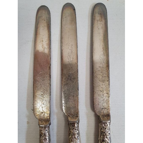 421 - Set of five silver-handled fruit knives and forks with embossed berry on vine decoration to the hand... 