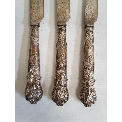 421 - Set of five silver-handled fruit knives and forks with embossed berry on vine decoration to the hand... 