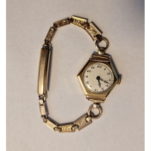 443 - Lady’s gold wristwatch with white enamel circular dial, Arabic numerals, within hexagonal case and t... 