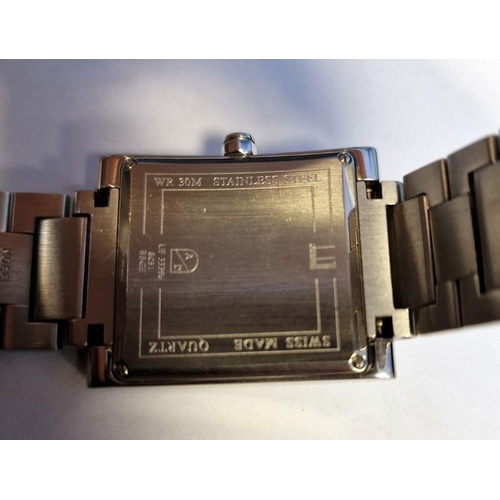 445 - Dunhill stainless steel gentleman's wristwatch with square face, sweep second hand and calendar aper... 