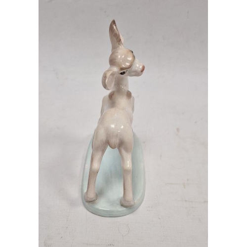 50 - Wedgwood & Co early 20th century handpainted pottery fawn, on pale blue oval base, 15.5cm high