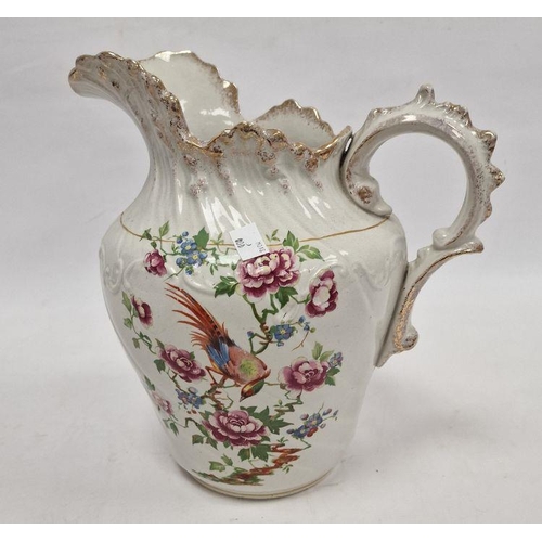 51 - Staffordshire pottery ewer and basin decorated with exotic bird and rose branches