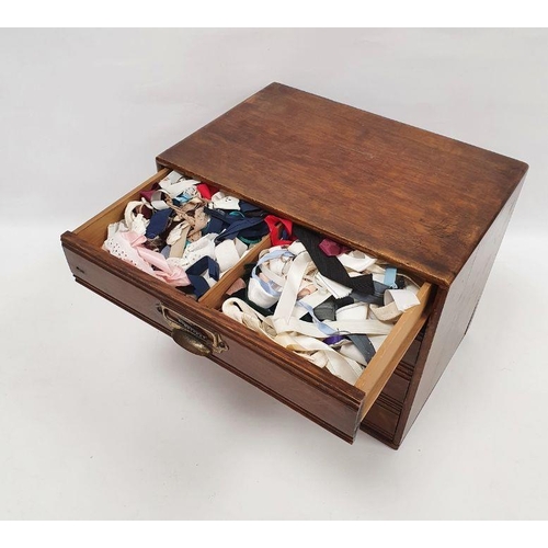 121 - Oak table-top nest of four drawers containing assorted sewing items, to include ribbons, reels of co... 