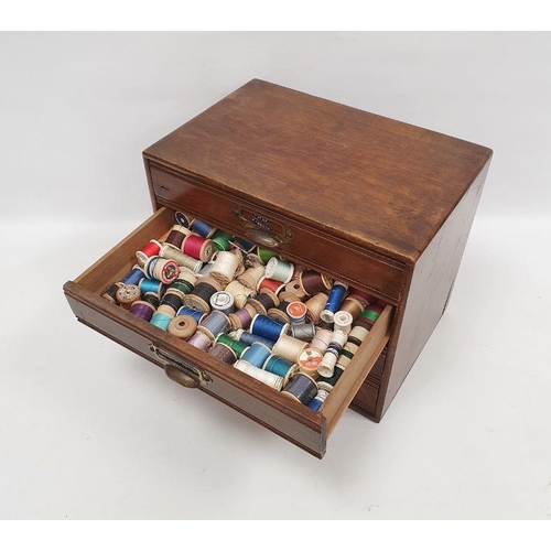 121 - Oak table-top nest of four drawers containing assorted sewing items, to include ribbons, reels of co... 