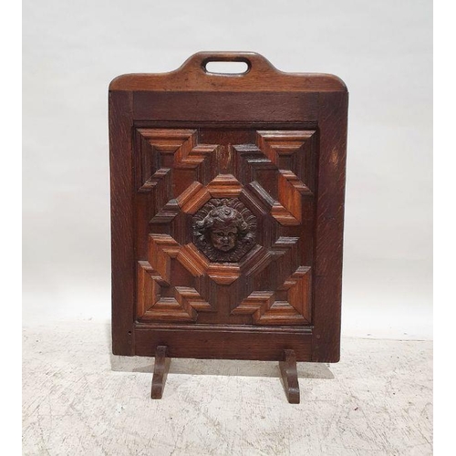 1257 - 20th century oak fire screen with applied moulded mask decoration