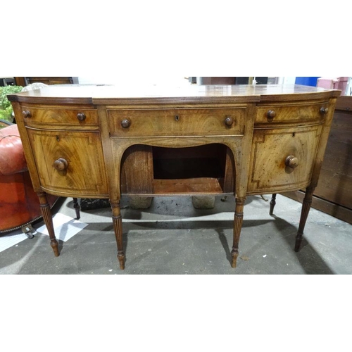 1269 - Regency mahogany sideboard of serpentine front with reeded edge, single drawer above tambour-fronted... 