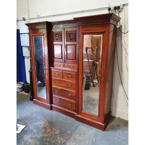 1313 - Late Victorian/early Edwardian breakfront wardrobe, the moulded cornice above centre of two cupboard... 