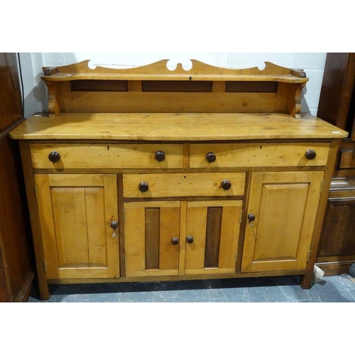 1315 - Vintage pine sideboard with a low shelf rack above the serpentine front, three drawers and four cupb... 