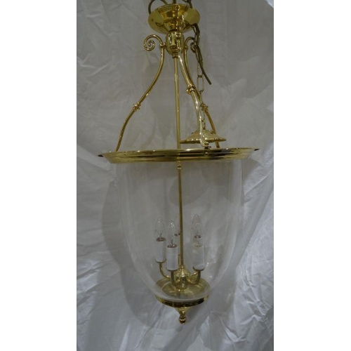 1320 - Reproduction Georgian-style hanging lantern of circular form, brass mounts with a glass shade and fi... 