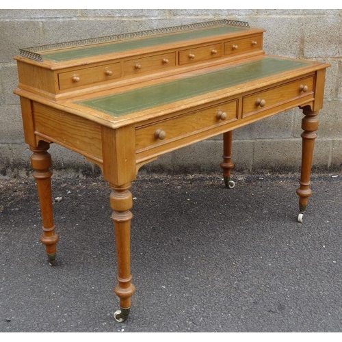 1328 - Victorian pine desk by Heal & Son, London, the three-quarter pierced brass gallery above the leather... 