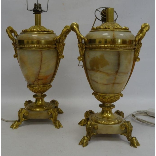 178 - Pair of marble and gilt bronze table lamps, the two-handled vase shaped bodies ornately decorated in... 