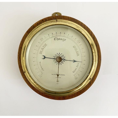 241 - Oak cased Negretti & Zambra (London) aneroid barometer, the silvered dial marked R/1298, 17.2cm diam... 