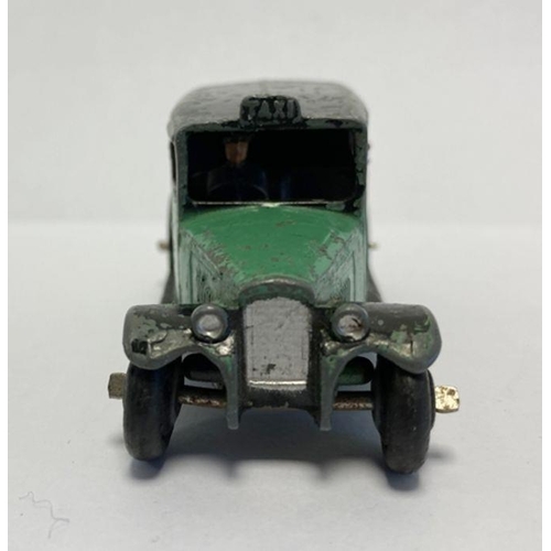 544 - Playworn Dinky diecast car 36g taxi with driver green body, black wheels and top