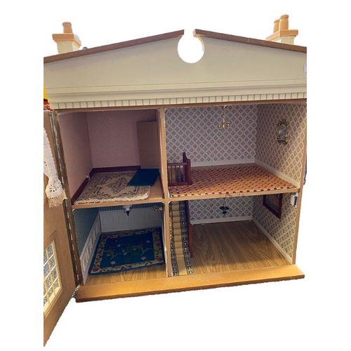 615 - Cream two story doll's house with a large collection of dolls, dolls house furniture to include cera... 