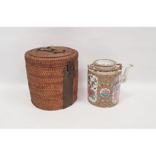 68 - Cantonese porcelain cylindrical teapot and cover in a wicker basket, painted in the famille rose pal... 