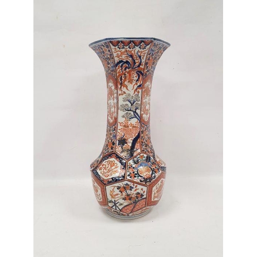 69 - Late 19th century Imari faceted baluster vase, with tall flared neck, painted with panels of preciou... 