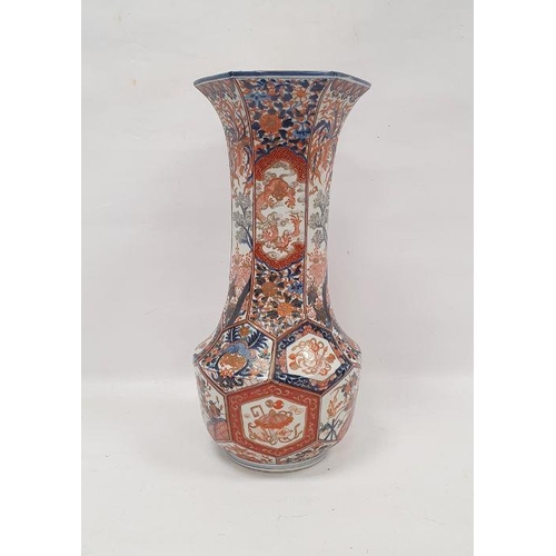 69 - Late 19th century Imari faceted baluster vase, with tall flared neck, painted with panels of preciou... 