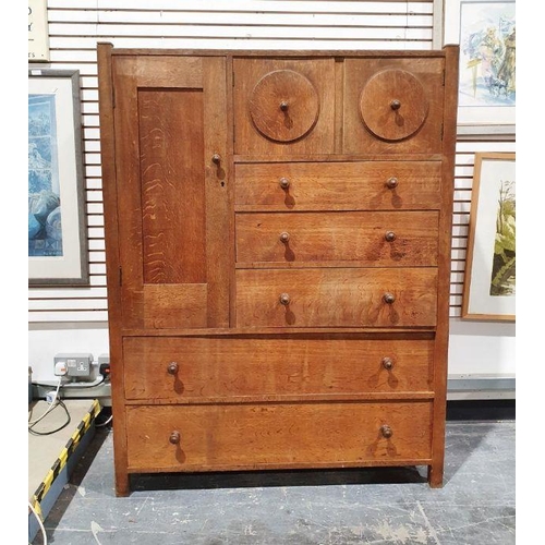 1145 - Early 20th century Heal & Son oak compactum, the wardrobe door to the left hand side above two long ... 