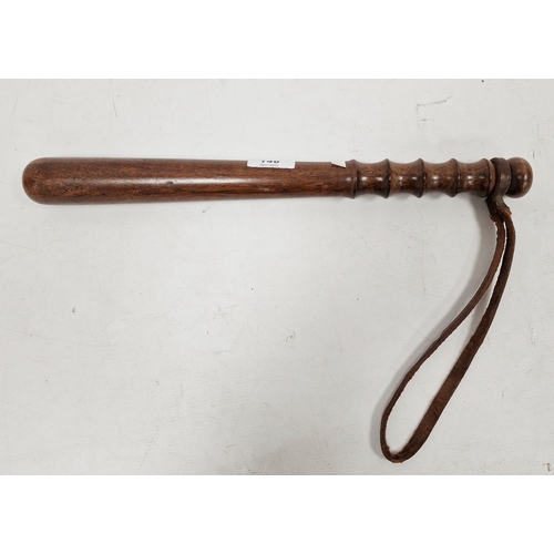 146 - Carved wooden truncheon with wrist strap, 38cm