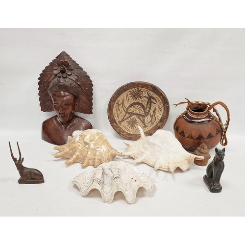 170 - Carved figure in feathered headdress, treen bowl, Egyptian-style cat, gazelle, gourd, seashells, etc... 