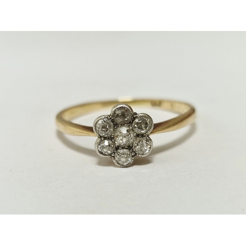 366 - Gold and diamond flowerhead cluster ring set seven small stones, in case