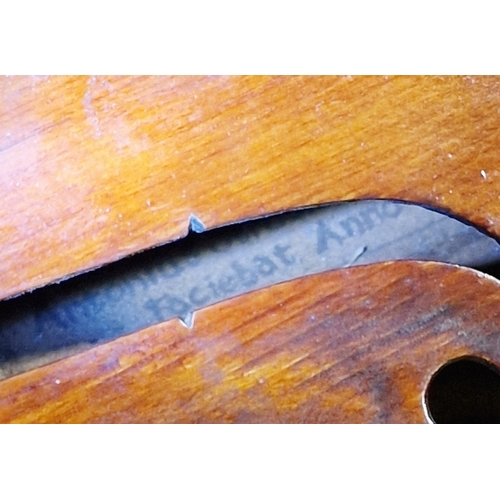 76 - Violin, in case, the pine top with scrolled sound holes, paper label inside 'Antonios Stradavarius A... 