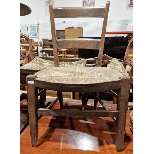 1227 - Two single mahogany tripod occasional tables with circular tops and a child's rush-seated chair (3)