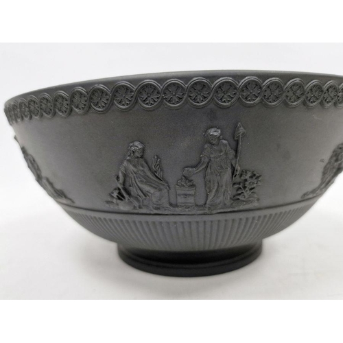 10 - Black basalt bowl in the manner of Wedgwood with decorated rim, the body with applied moulded scenes... 