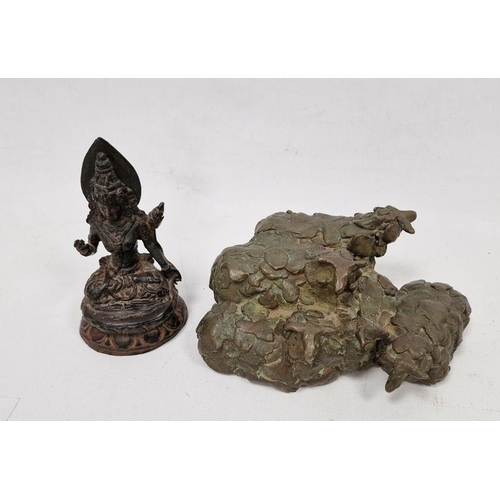 130 - A 20th century bronze sculpture of  group of sheep together with a cast metal figure of a seated dei... 