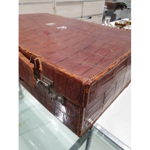 136 - Crocodile skin suitcase, early to mid 20th century, gilt lettering stamped for John Bagshaw & Sons, ... 