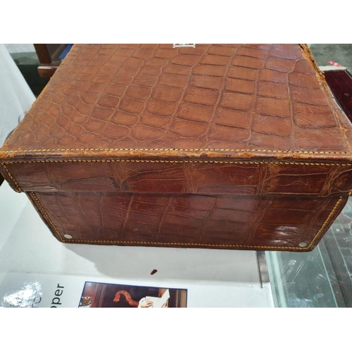 136 - Crocodile skin suitcase, early to mid 20th century, gilt lettering stamped for John Bagshaw & Sons, ... 