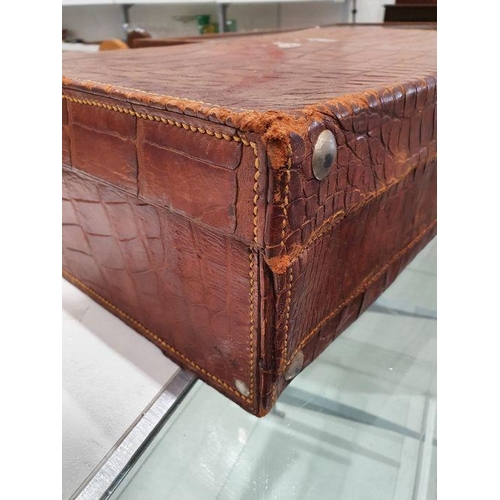 136 - Crocodile skin suitcase, early to mid 20th century, gilt lettering stamped for John Bagshaw & Sons, ... 