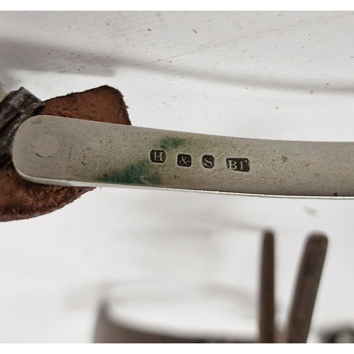 151 - Single iron spur with large spike wheel and a pair of white metal and leather spurs (3)