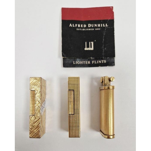 167A - Three Dunhill lighters in a gold coloured finish (3).