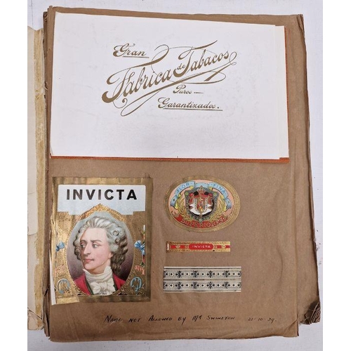 174 - Assorted ephemera to include cigar papers, wrappers, boxes, etc stuck down in book