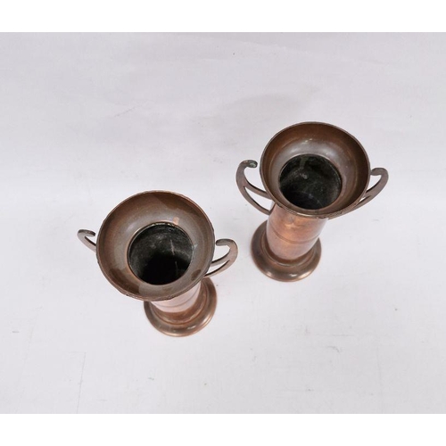 184 - Pair of Arts and Crafts copper two handled vases, each cylindrical with flared rim, stamped 'British... 